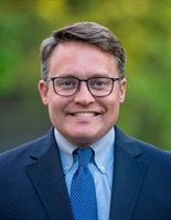 Head of Chair, Matt de Ferranti - Gentleman in suit and tie.