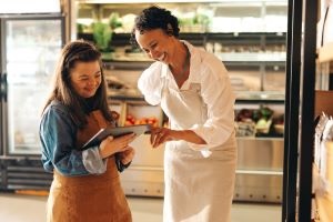 Girl in apron with supervisor.jpg