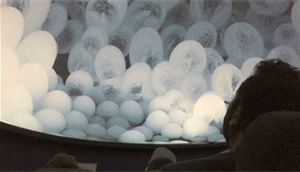 Person watching planetarium show