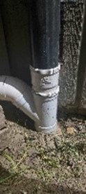 Close up photo of downspout connection.