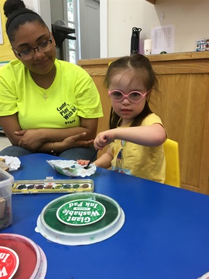Inclusion staff supporting a participant.jpg