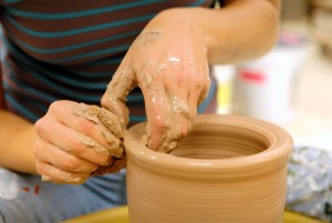 Person creating ceramic pottery