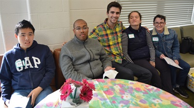 A group of 5 participants and mentors socializing