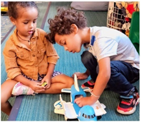 children playing with toy in classroom